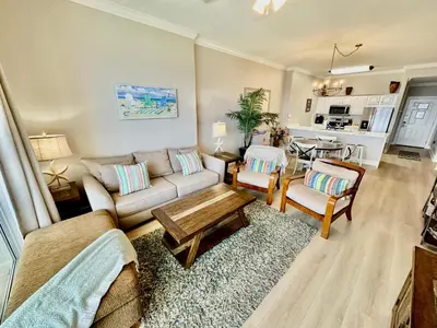 a living room with a couch and a table at Ocean Reef 1907 in Panama City Beach