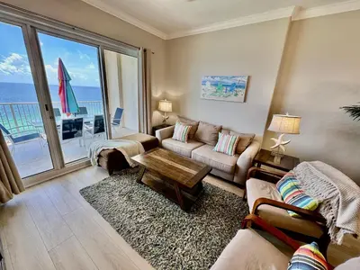 a living room with a couch and a table at Ocean Reef 1907 in Panama City Beach