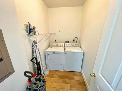 a small laundry room with a washer and dryer at Ocean Reef 2103 in Panama City Beach