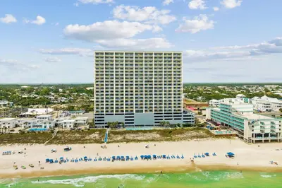 an aerial view of a beach with a tall building at Ocean Reef 2103 in Panama City Beach