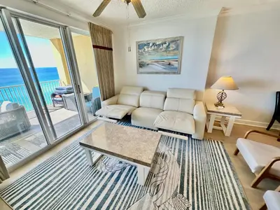 a living room with a couch and a table at Tropic Winds 1201 in Panama City Beach