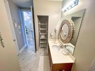 a bathroom with a sink and a mirror at Ocean Reef 2204 in Panama City Beach