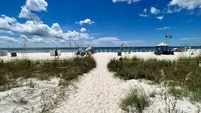 a white sandy beach with the ocean in the background at Ocean Reef 2204 in Panama City Beach