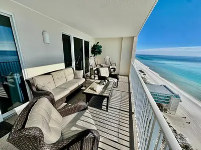 a living room with a couch and chairs on the beach at Ocean Reef 1705 in Panama City Beach