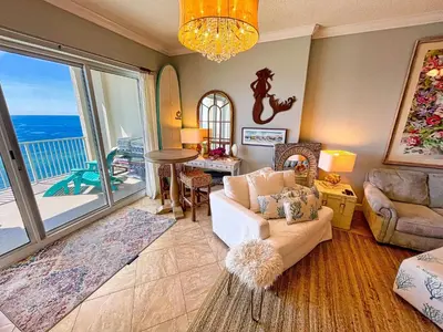 a living room with a view of the ocean at Ocean Reef 1903 in Panama City Beach