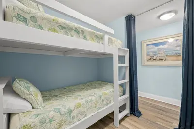 a bedroom with two bunk beds in a room at Laketown Wharf #1517 by Nautical Properties in Panama City Beach