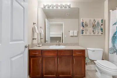 a bathroom with a sink and a toilet at Laketown Wharf #0702 in Panama City Beach