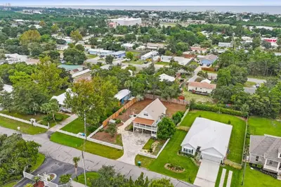 an aerial view of a residential neighborhood with houses at Nest & Nook, Hot Tub, Fire pit, Deck, Yard, close to lake in Panama City Beach