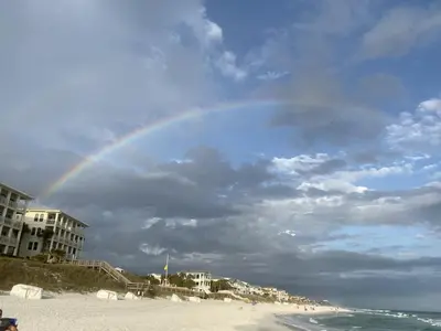 a rainbow in the sky over the beach at Nest & Nook, Hot Tub, Fire pit, Deck, Yard, close to lake in Panama City Beach