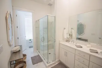 a bathroom with a glass shower and a sink at POOL | Heart & Soul Luxury | Walk to Beach in Inlet Beach