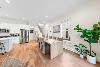 a kitchen and dining room with a table and chairs at Walk to Beach! Sleeps 18 - 10 beds in Rosemary Beach