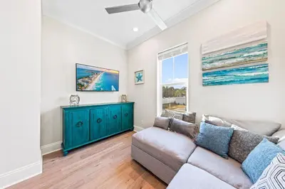 a living room with a couch and a window at Walk to Beach! Sleeps 18 - 10 beds in Rosemary Beach
