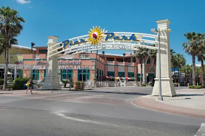 a large building with a large sign on a street at Beach Haven! 2BR 2BA Sleeps 6! Coastal paradise awaits! in Panama City Beach