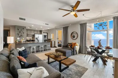 a living room with a couch and a table at 707 Sterling Reef in Panama City Beach