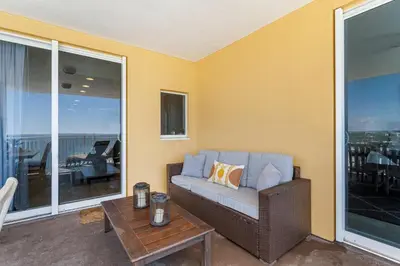 a living room with a couch and a table at 707 Sterling Reef in Panama City Beach