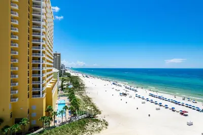 a view of the beach from the balcony of a resort at 707 Sterling Reef in Panama City Beach