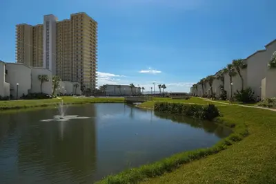 a pond with a fountain in the middle of a city at Sugar Beach C1 in Panama City Beach