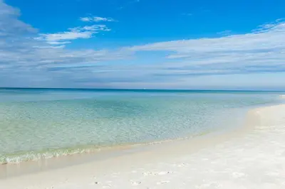 a beach with the ocean and the sky at Sugar Beach C1 in Panama City Beach