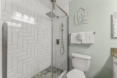 a bathroom with a shower and a toilet at Solitude on 30A - Seacrest Beach - Beach Access in Rosemary Beach