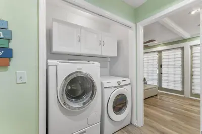 a laundry room with a washer and dryer in it at Solitude on 30A - Seacrest Beach - Beach Access in Rosemary Beach