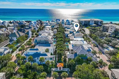 an aerial view of a neighborhood with houses and the ocean at Seas The Day in Rosemary Beach