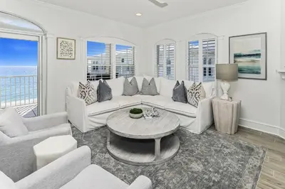 a living room with a couch and a table at B402 Sunset Beach Villa in Inlet Beach