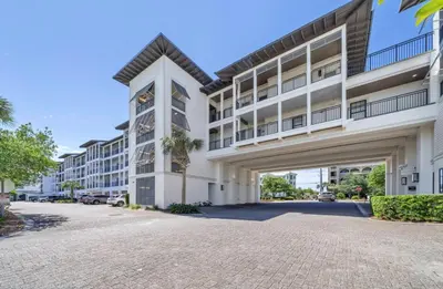 a large white building with a parking lot at WaterHouse 401 in Seacrest