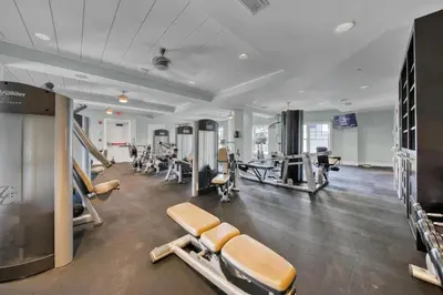 a gym with several treadmills and exercise machines at WaterHouse 401 in Seacrest