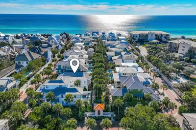 an aerial view of a neighborhood with houses and the ocean at Daydreams By The Sea in Seacrest