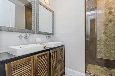 a bathroom with two sinks and a shower at Buena Vista in Santa Rosa Beach