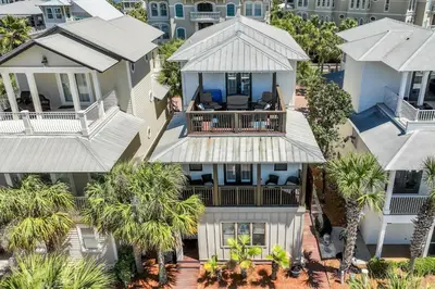 an aerial view of a house with palm trees at Sip N' Sea in Seacrest