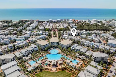 an aerial view of a resort with a pool and the ocean at Sip N' Sea in Seacrest