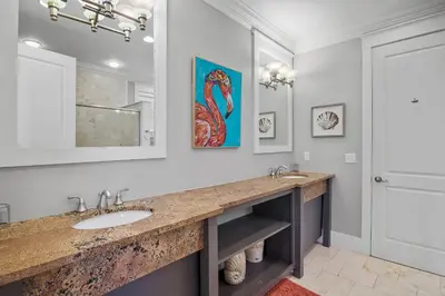 a bathroom with a sink and a mirror at Sip N' Sea in Seacrest