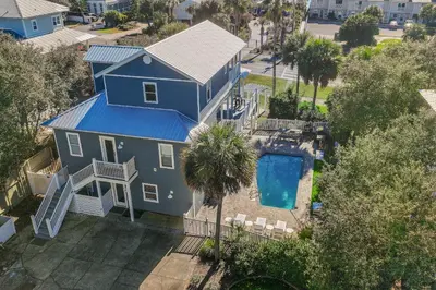 an aerial view of a blue house with a swimming pool at Caribbean Breeze in Seacrest