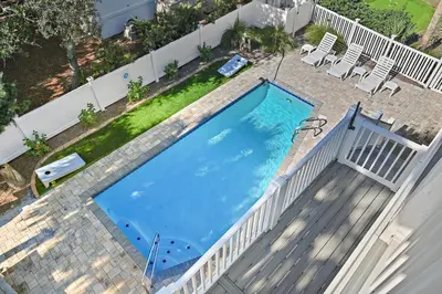 an overhead view of a swimming pool on a deck at Caribbean Breeze in Seacrest