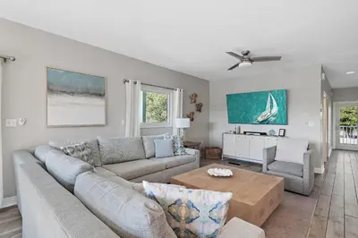 a living room with a couch and a table at Caribbean Breeze in Seacrest