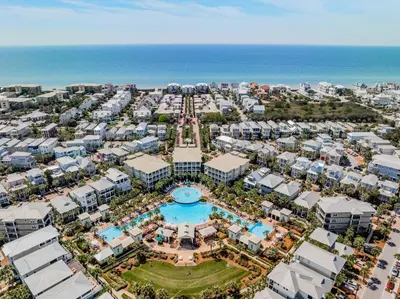 an aerial view of a resort with a pool and the ocean at 28 Beach Bike Way in Santa Rosa Beach