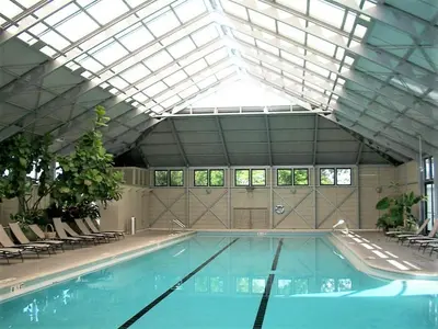 a large swimming pool with a glass ceiling at Mercado at Rosemary 4A in Rosemary Beach