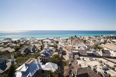an aerial view of a town with houses and the ocean at Mercado at Rosemary 4A in Rosemary Beach