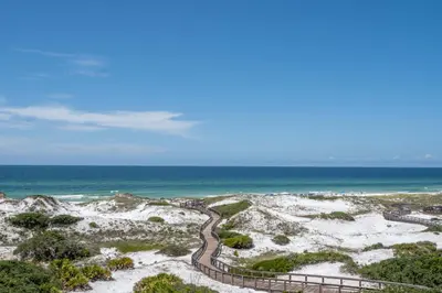 a path through the sand at the beach at Compass Point 1, Unit 204 in Watersound Beach