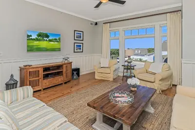 a living room with a couch and a table at Compass Point 1, Unit 204 in Watersound Beach