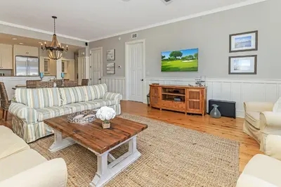 a living room with two couches and a table at Compass Point 1, Unit 204 in Watersound Beach