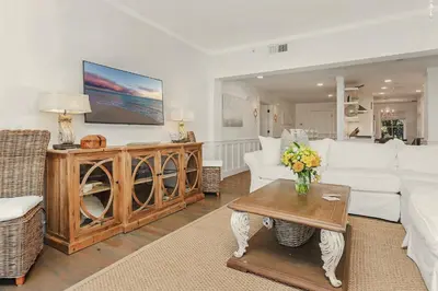 a living room with a white couch and a table at Crossings at WaterSound B105 in Watersound Beach