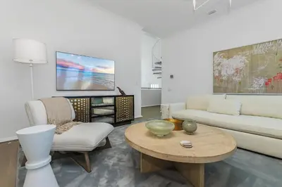 a living room with a couch and a table at Ocean in Inlet Beach