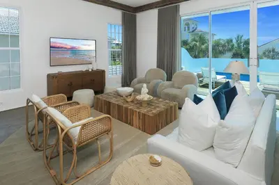 a living room with a white couch and chairs at Ocean in Inlet Beach