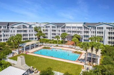 an aerial view of a resort with a large swimming pool at The Golden Pearl in Watersound Beach