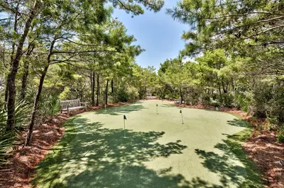a golf course with three putts in the middle at The Golden Pearl in Watersound Beach