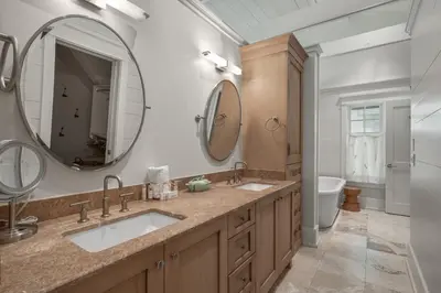 a bathroom with two sinks and a mirror at 217 Gulf Bridge Lane in Watersound Beach