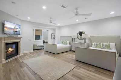 a living room with two couches and a fireplace at 239 Pelican Circle in Inlet Beach