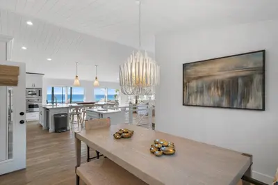a kitchen and dining room with a table and a dining room and a kitchen at 239 Pelican Circle in Inlet Beach